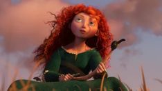 a red haired woman sitting on top of a grass covered field