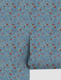 the blue and red flowered fabric is folded on top of each other