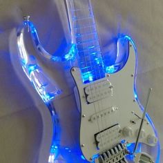 an electric guitar with blue lights on it