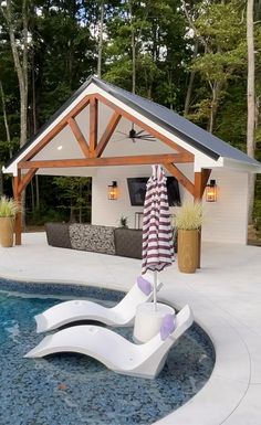 an outdoor living area with a pool and patio furniture