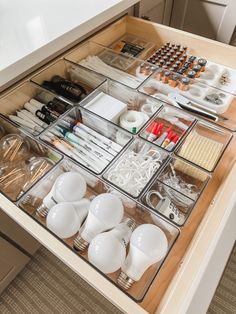an organized drawer is shown with various items