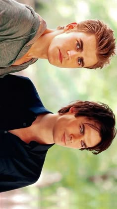 two young men standing next to each other