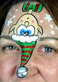 a woman with her face painted to look like an elf