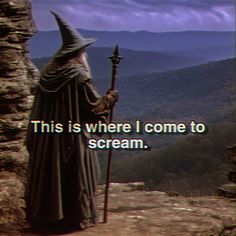 a wizard standing on top of a cliff with a screech in his hand