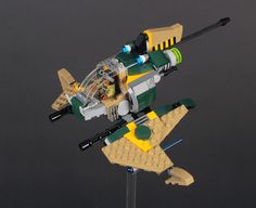 a toy airplane made out of legos sitting on top of a metal stand next to a black background