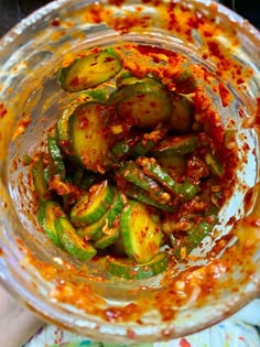 a glass bowl filled with lots of food