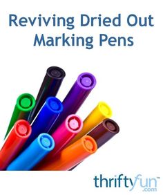 several different colored pens sitting in a row with the words reviewing dried out marking pens