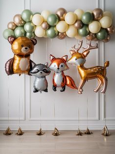 some balloons are hanging in the shape of animals