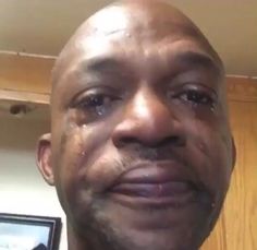 an older man is smiling and looking at the camera with tears on his face as he stares into the camera