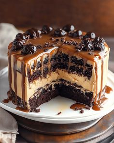 a chocolate cake on a plate with one slice cut out