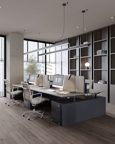 an office with two desks and chairs in front of a large window, next to a bookshelf