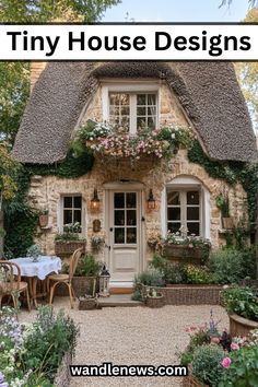 an old stone house with flowers and potted plants