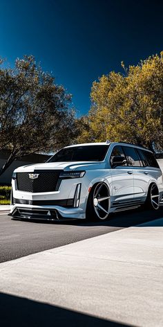 a white car is parked on the street