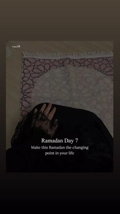 a person laying on top of a bed with their hand up to the ground and text reading rama day 7 make this ramaan the changing point in your life