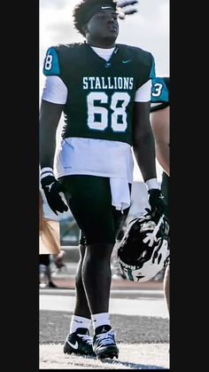 a football player is walking on the field