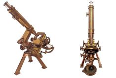 two old fashioned telescopes sitting next to each other