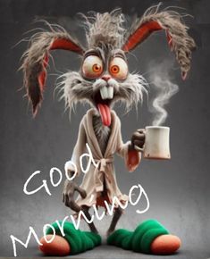 a rabbit holding a coffee cup with the words good morning on it's side