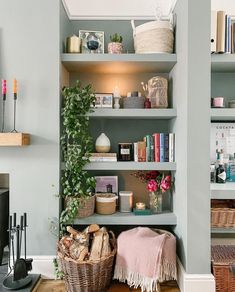 a living room filled with lots of books and furniture