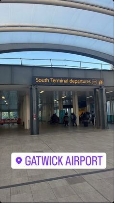 an airport terminal with the words gatwick airport on it's front door