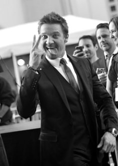 a man in a suit and tie making a silly face