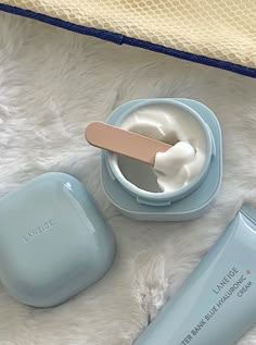 Blue Skincare Aesthetic, Laneige Blue Cream, Laneige Blue, Blue Skincare, Light Blue Skin Care, Light Blue Skincare Aesthetic, Blue And White Skincare, Laneige Blue Hyaluronic Cream, Laneige Skincare Products On Blue Background