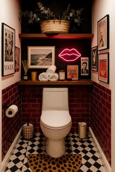 a white toilet sitting in a bathroom under a neon sign