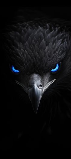 an eagle with glowing blue eyes in the dark