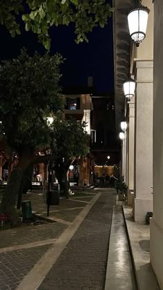 an empty street at night with lights on