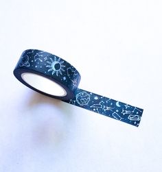 a roll of washi tape with an image of the moon and stars on it