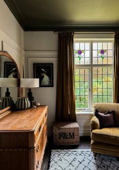a living room filled with furniture next to a window