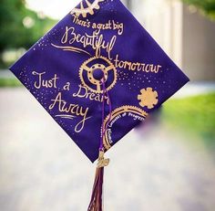 a purple graduation cap with writing on it that says, there's about to be beautiful tomorrow just a dream away