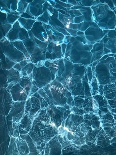 the water is very clear and blue with little ripples on it's surface