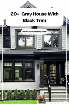 Modern gray family home with black trim and a welcoming front porch.