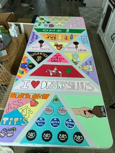 a large table covered in lots of stickers and magnets on top of it