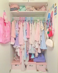 a closet filled with lots of baby clothes