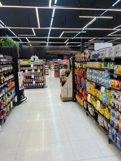 an aisle in a grocery store filled with lots of food