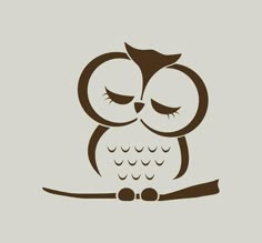 an owl with closed eyes sitting on a branch