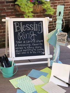 a sign that says blessing ring on it next to some pens and paper pieces in a bucket