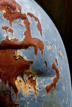 an old rusted metal object is shown in close up