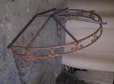 there is a metal object hanging on the wall