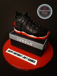 a shoe is sitting on top of a box with the name jordan written on it