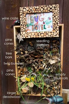 a wooden shelf filled with lots of different types of wood and plants next to a fence