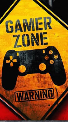 a warning sign with a video game controller in front of the word gamer zone on it