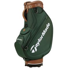 a green golf bag with the words taylormade on it's front and side