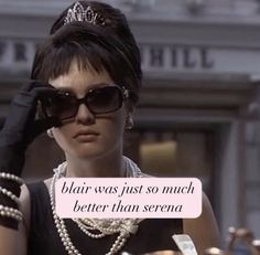 a woman in sunglasses and pearls is holding her hand up to her face with the words blai was just so much better than serena