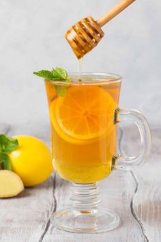 the honey and lemon water benefits and recipe are shown in front of a glass mug