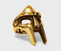 a gold mask on a white background
