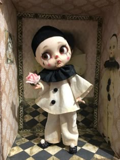 a creepy doll holding a rose in its hand