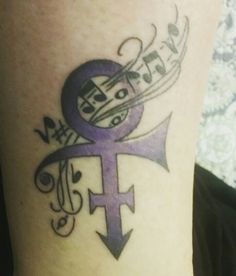 a woman with a tattoo on her leg that has music notes and an amp in it