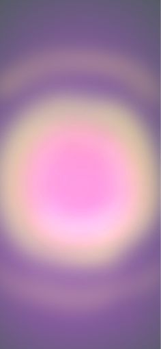 a blurry background with an oval shape in pink and yellow colors on the center